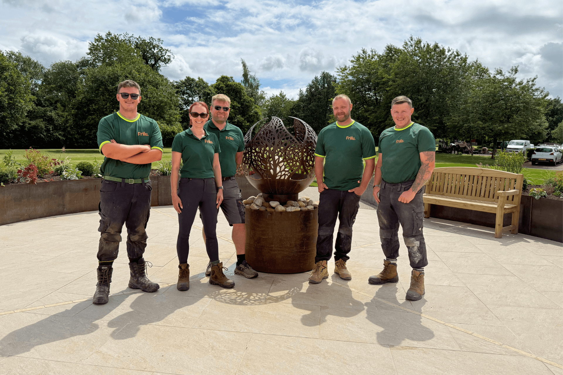 the Frilu design and build team including co-owners Amanda Ingram and Paul Moran posing with the completed Fire Fighters Charity garden at Jubilee House, Penrith