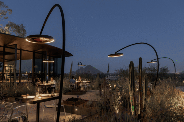 Eclipse outdoor heating and lighting product at a restaurant outdoor seating area in the evening